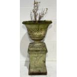 A sectional weathered garden urn on plinth with basket pattern - overall height 93cm