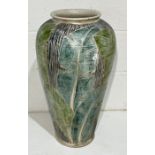 A large art pottery vase with foliate decoration - height 76cm