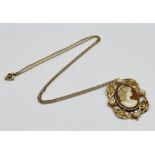 A 9ct gold cameo pendant with foliate decoration and seed pearls on a 9ct gold chain