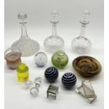 A collection of various glassware including ship's decanter, pair of decanters with etched detail,