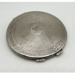 A hallmarked silver compact