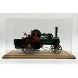 A 3/4 inch scale "Burrell" type agricultural live steam traction engine in display case