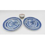 A pair of Chinese blue and white ceramic plates along with a famile rose tea bowl