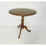 A Victorian oval tripod table