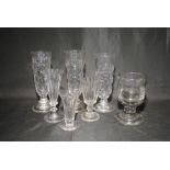 A collection of antique drinking glasses including a rummer, ale glasses etc.