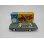 A boxed Corgi Toys Ghia L.6.4 die-cast car in sage green with cream interior and corgi dog