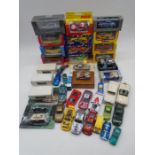 A collection of die-cast vehicles (boxed and unboxed) including Burago, Maisto, Solido, Corgi, Hot