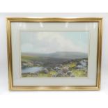 A framed watercolour of a moorland scene signed R D Sherrin - 40cm x 51cm