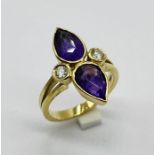 An amethyst and diamond ring set in 18ct gold