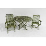 A weathered wooden garden table with three chairs