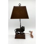 A Theodore Alexander lamp with bronze lion on wooden base and leather shade - height 61cm