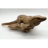 A large wooden carved lizard - 69cm long