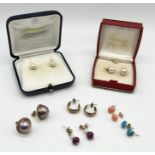 A collection of gold earrings set with pearls, turquoise, coral etc.