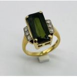 An 18ct gold tourmaline and diamond ring in the Art Deco style