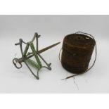 An antique garden string winder along with a roll of sisal string