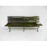 A Victorian weathered cast iron framed garden bench with wooden slatted seating (A/F) - length
