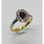 An 18ct gold ruby and diamond cluster ring