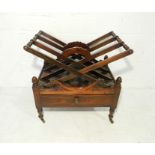A Victorian rosewood Canterbury with X framed supports