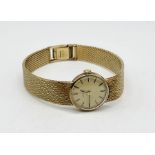 A ladies 9ct gold Omega wristwatch on original 9ct gold strap, total weight including movement 28.