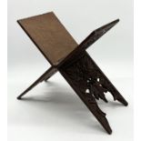 An Eastern carved wooden folding book rest