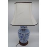 A Chinese blue and white vase. Approx. Height including shade 76cm