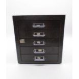 A small industrial filing cabinet with five drawers. 29cm x 39cm, height 32cm