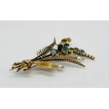 A late 20th Century 9ct gold brooch with fern decoration set with semi precious stones and pearls,