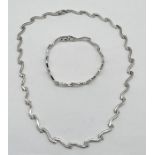 A 9ct white gold necklace and matching bracelet, weight 22.8g