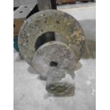 Three vintage mill stones. Diameter of largest is 50cm