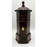 A Victorian style hexagonal pillar form post box with with carved detail and turned finial, single