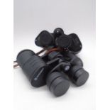 A pair of Bresser 10x50 binoculars along with a pair of Octra 7x50's
