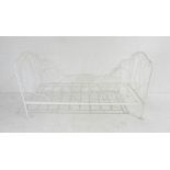 A vintage folding wrought iron day bed