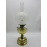 An early 20th century brass oil lamp- shade repaired
