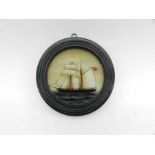 A framed miniature oil painting of a British frigate - diameter 10.5cm