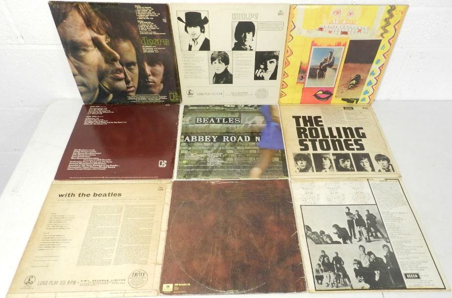 A small collection of 12" and 7" vinyl records comprising of The Doors, The Beatles, Paul and - Image 4 of 5