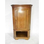 A Georgian oak corner cupboard on open base - length 88cm, height 155cm