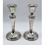 A pair of hallmarked silver candlesticks, height 14.75cm