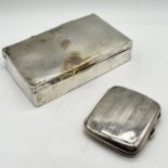 A silver cigarette box along with a silver cigarette case