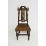 A Victorian carved oak hall chair with barley twist supports