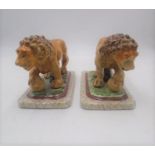 A pair of reproduction Staffordshire Lions.