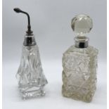 A silver collared scent bottle along with a silver mounted atomiser