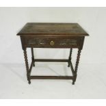 A carved oak hall table with single drawer, raised on bobbin turned legs - length 69cm, depth