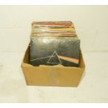 A quantity of 12" vinyl records including Pink Floyd, The Beatles, Black Sabbath, AC/DC, Elton John,