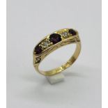 An 18ct gold diamond and ruby 5 stone ring