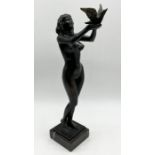 A small bronze of a nude releasing a dove signed Alexander Haito '95 (?) 23.5cm height