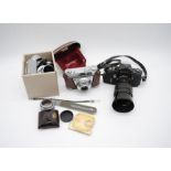 A Miranda No. 702569 film camera along with a Kodak Retinette 1A film camera and a quantity of