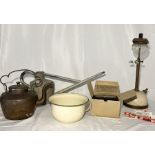 A collection of various items including Tilley lamp, galvanised watering can, child's gas mask,