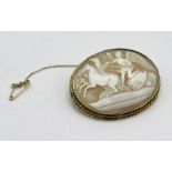 A 9ct gold cameo depicting "Peace taming the horses of Mars"