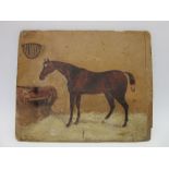 A 19th century unsigned oil on board of a horse in a stable