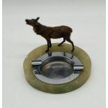 A vintage onyx ashtray with cold painted deer